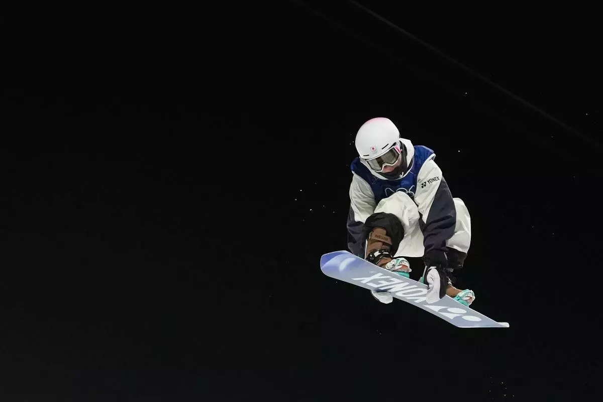 Japan's Yuto Totsuka competes during the men's snowboarding halfpipe finals at the 2026 Winter Olympics, in Livigno, Italy, Friday, Feb. 13, 2026. (AP Photo/Lindsey Wasson)