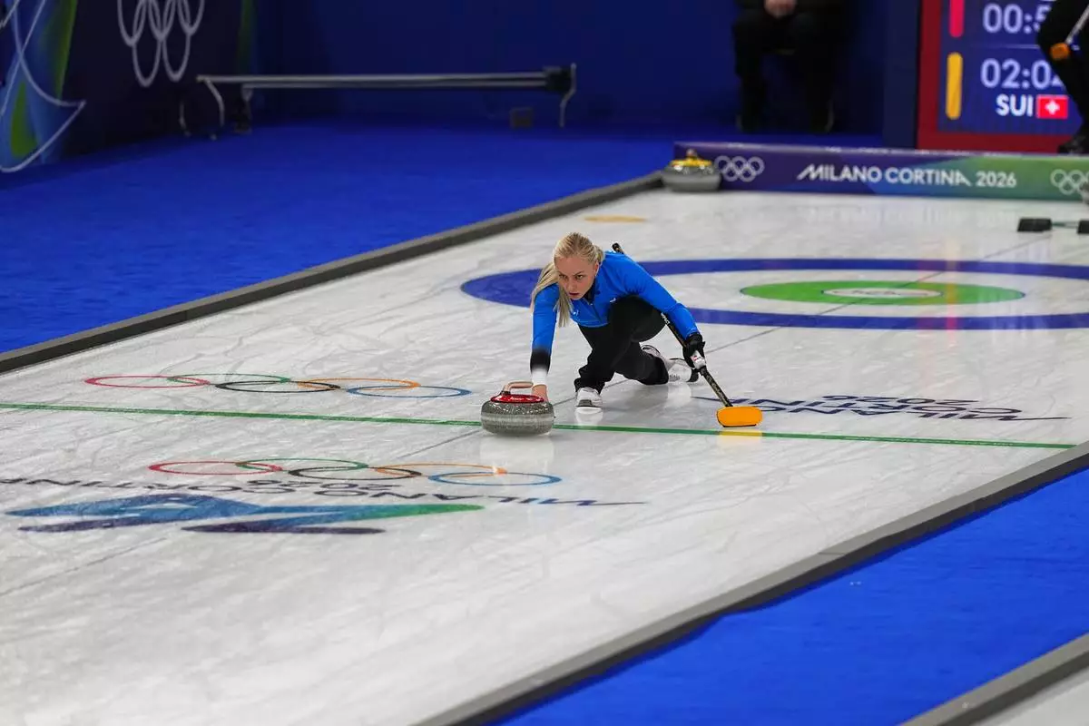 Estonia's Marie Kaldvee in action during the mixed doubles round robin phase of the curling competition against Switzerland, at the 2026 Winter Olympics, in Cortina d'Ampezzo, Italy, Wednesday, Feb. 4, 2026. (AP Photo/Fatima Shbair)