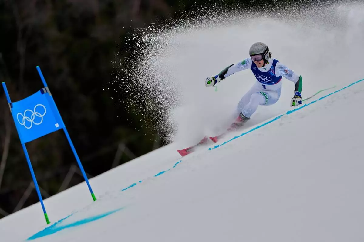 Brazil's Lucas Pinheiro Braathen speeds down the course, during an alpine ski, men's giant slalom race, at the 2026 Winter Olympics, in Bormio, Italy, Saturday, Feb. 14, 2026. (AP Photo/John Locher)
