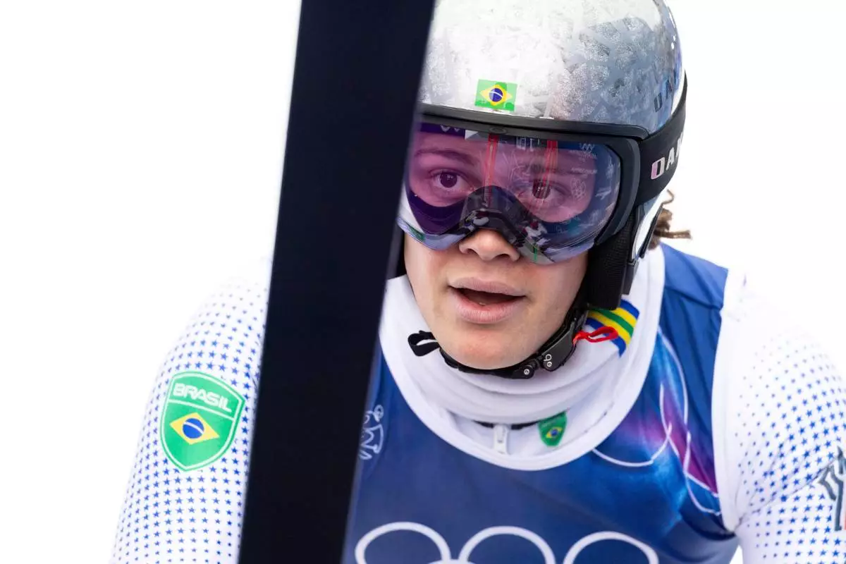 Brazil's Lucas Pinheiro Braathen checks his time at the finish area after the first run of an alpine ski, men's giant slalom race, at the 2026 Winter Olympics, in Bormio, Italy, Saturday, Feb. 14, 2026. (Michael Buholzer/Keystone via AP)