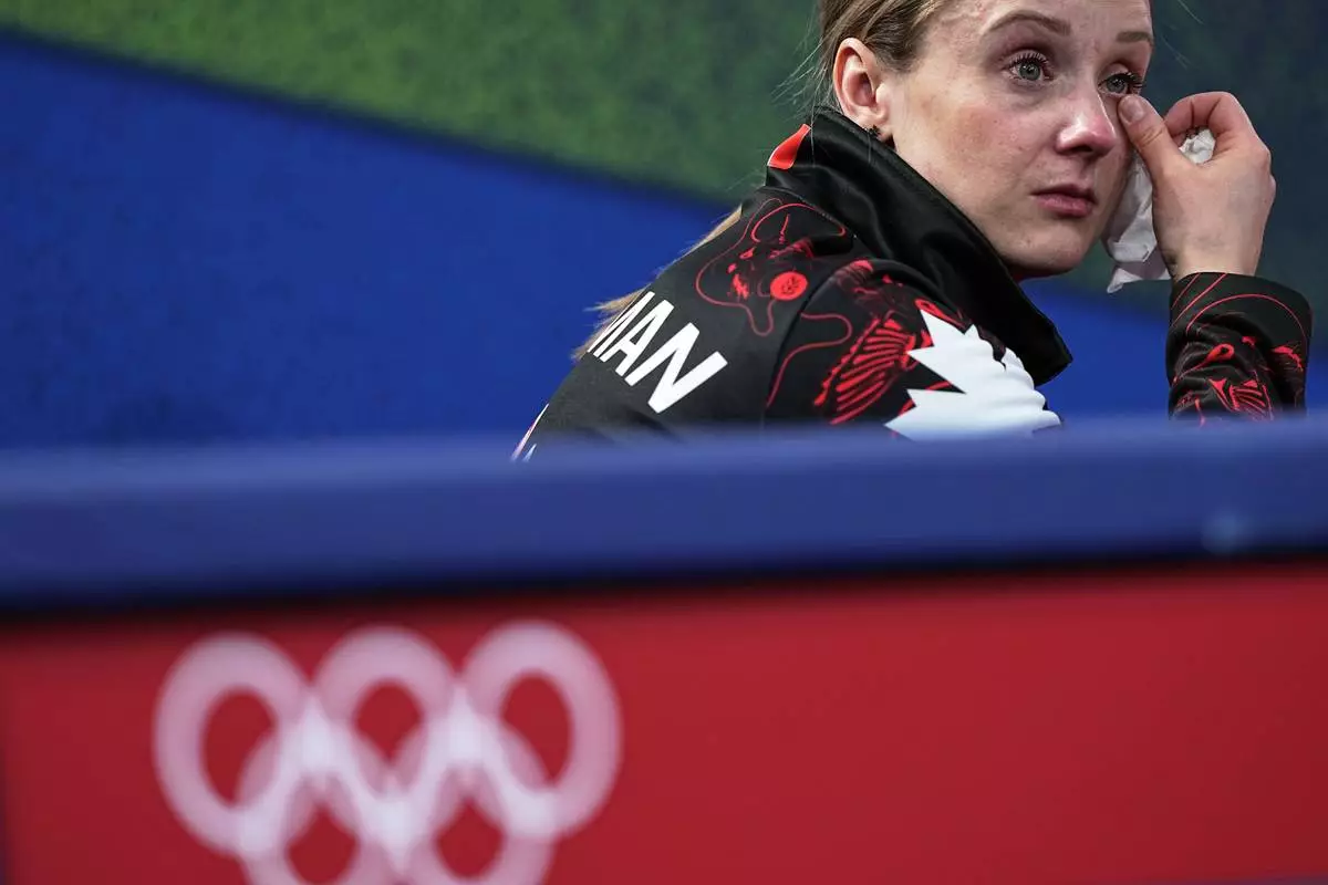 Canada's Jocelyn Peterman reacts during the mixed doubles round robin phase of the curling competition against Sweden, at the 2026 Winter Olympics, in Cortina d'Ampezzo, Italy, Sunday, Feb. 8, 2026. (AP Photo/Fatima Shbair)