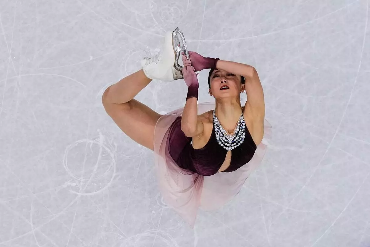 Kaori Sakamoto of Japan competes during the figure skating women's team event at the 2026 Winter Olympics, in Milan, Italy, Sunday, Feb. 8, 2026. (AP Photo/Bernat Armangue)