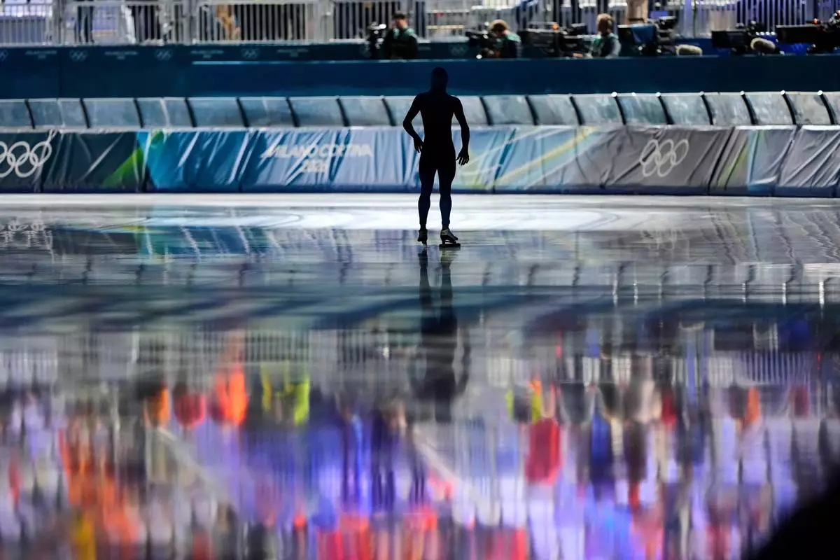 A forerunner prepares to skate a test lap ahead of the men's 5,000 meters speedskating race at the 2026 Winter Olympics, in Milan, Italy, Sunday, Feb. 8, 2026. (AP Photo/Ben Curtis)