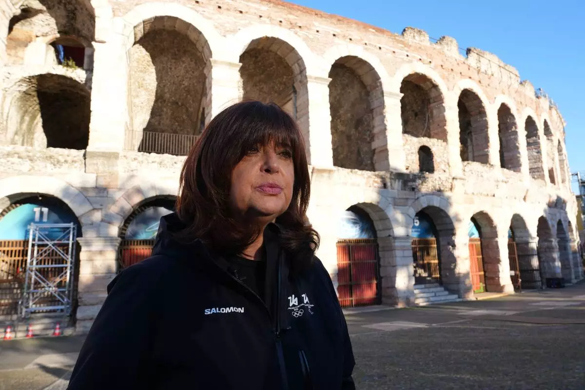 Director of ceremonies Maria Laura Iascone speaks, during an interview with The Associated Press, outside the Arena ahead of the closing ceremony at the 2026 Winter Olympics, in Verona, Italy, Tuesday, Feb. 17, 2026. (AP Photo/Antonio Calanni)