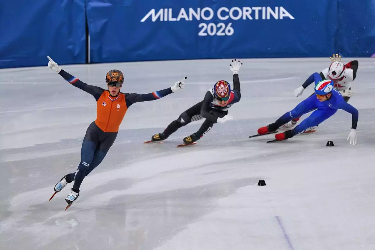 Jens van 't Wout of the Netherlands celebrates during a short track speed skating men's 5000 meters relay final at the 2026 Winter Olympics, in Milan, Italy, Friday, Feb. 20, 2026. (AP Photo/Stephanie Scarbrough)