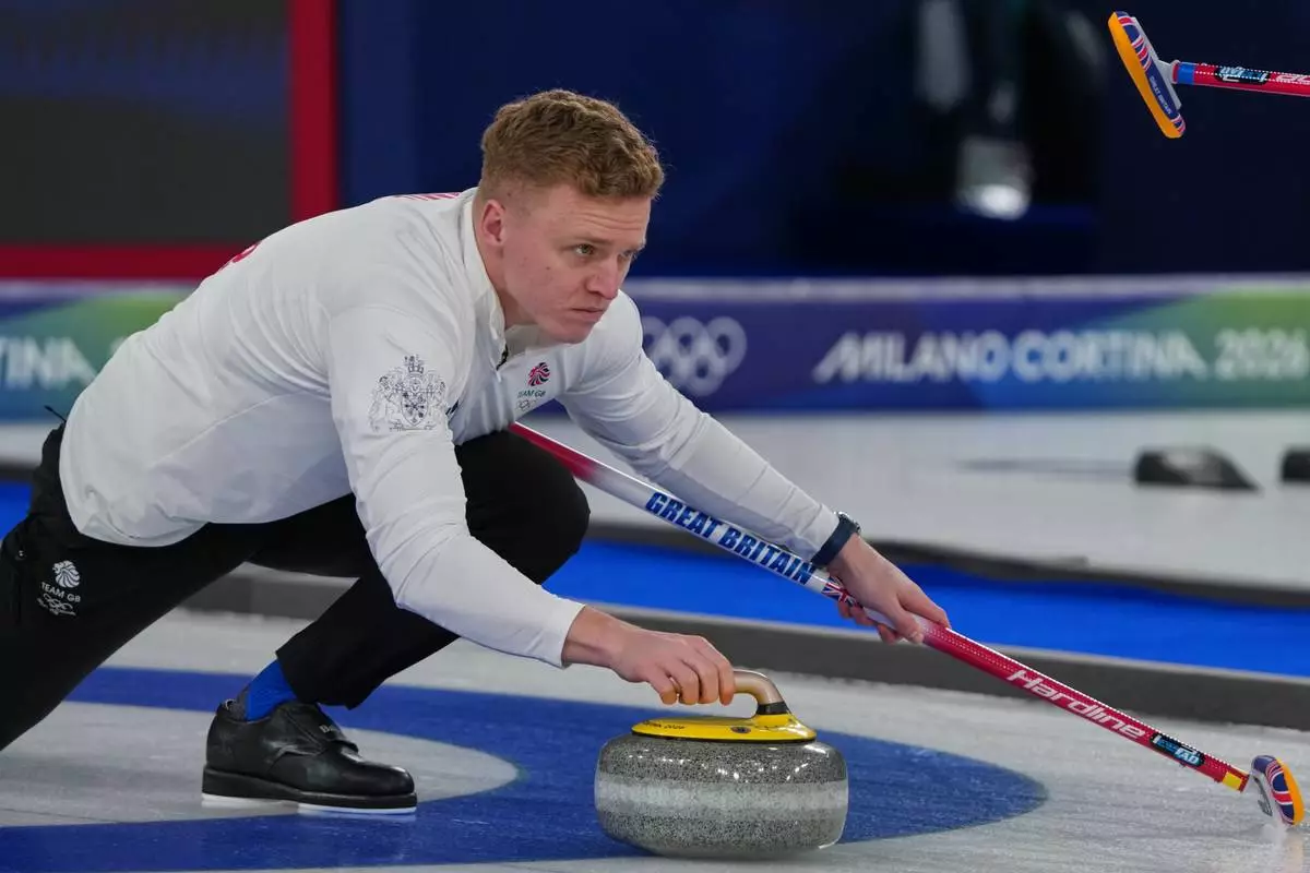 Britain's Bobby Lammie in action during the men's curling round robin session against Germany, at the 2026 Winter Olympics, in Cortina d'Ampezzo, Italy, Sunday, Feb. 15, 2026. (AP Photo/Misper Apawu)