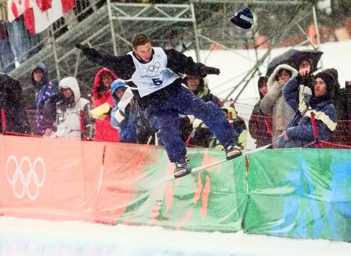 FILE - Gian Simmen of Switzerland loses his hat during a maneuver on his way to winning the gold medal in the men's halfpipe competition Thursday, Feb. 12, 1998, in Yamanouchi, Japan. (AP Photo/Robert F. Bukaty, FIle)