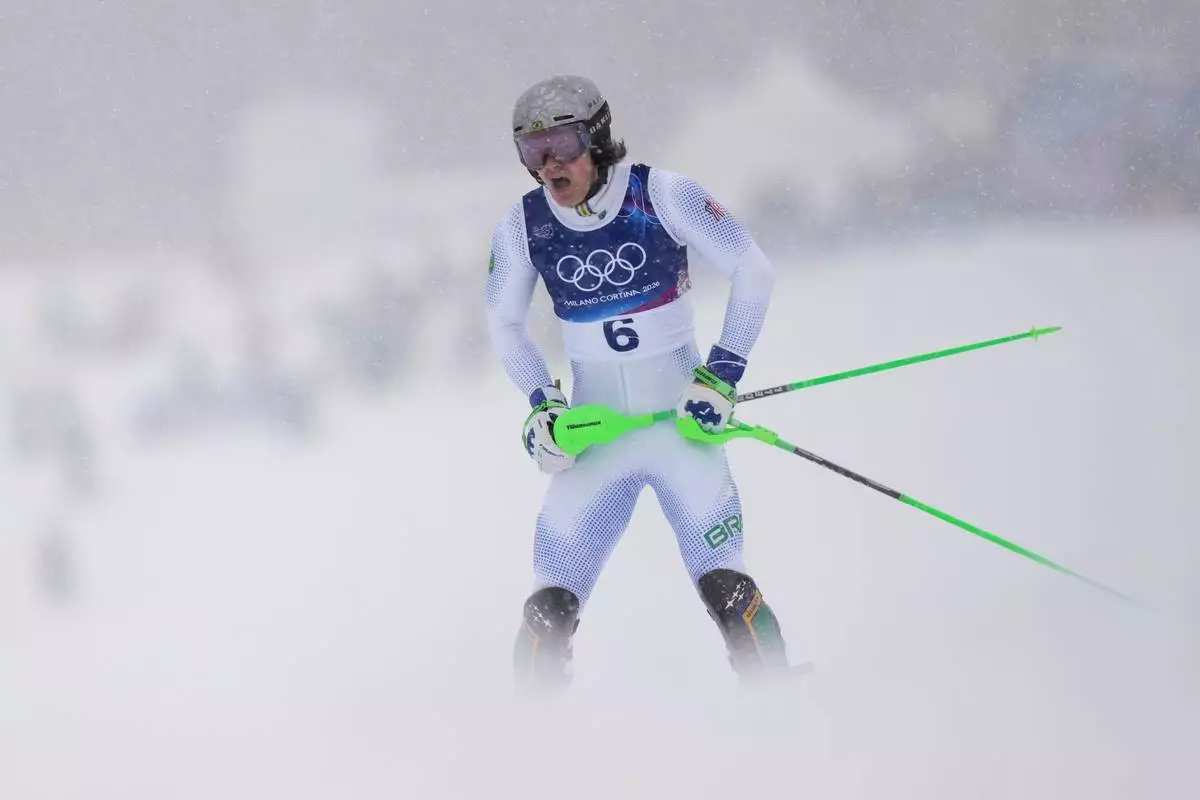 Brazil's Lucas Pinheiro Braathen reacts after crashing during an alpine ski, men's slalom race, at the 2026 Winter Olympics, in Bormio, Italy, Monday, Feb. 16, 2026. (AP Photo/Julia Demaree Nikhinson)