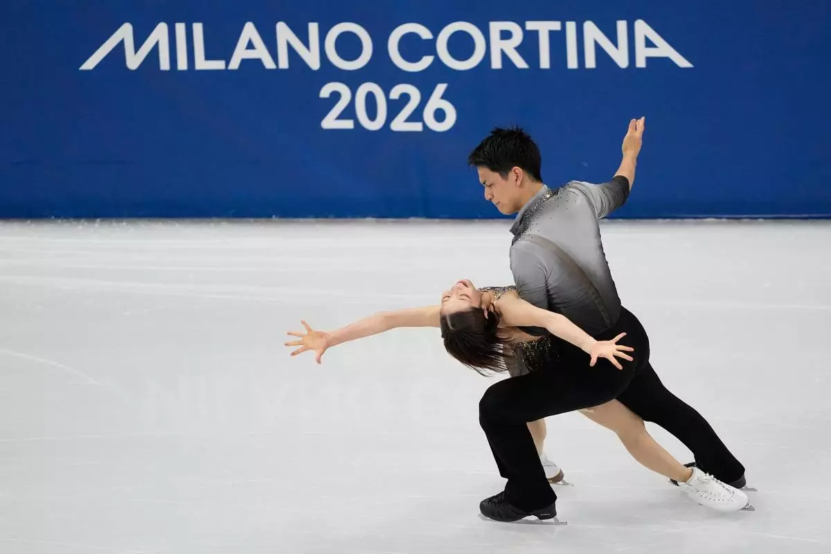 Riku Miura and Ryuichi Kihara of Japan compete during the pairs figure skating long program at the 2026 Winter Olympics, in Milan, Italy, Monday, Feb. 16, 2026. (AP Photo/Natacha Pisarenko)