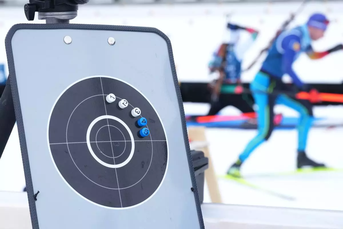 Athletes participate in a biathlon training session at the 2026 Winter Olympics in Anterselva, Italy, Monday, Feb. 16, 2026. (AP Photo/Andrew Medichini)