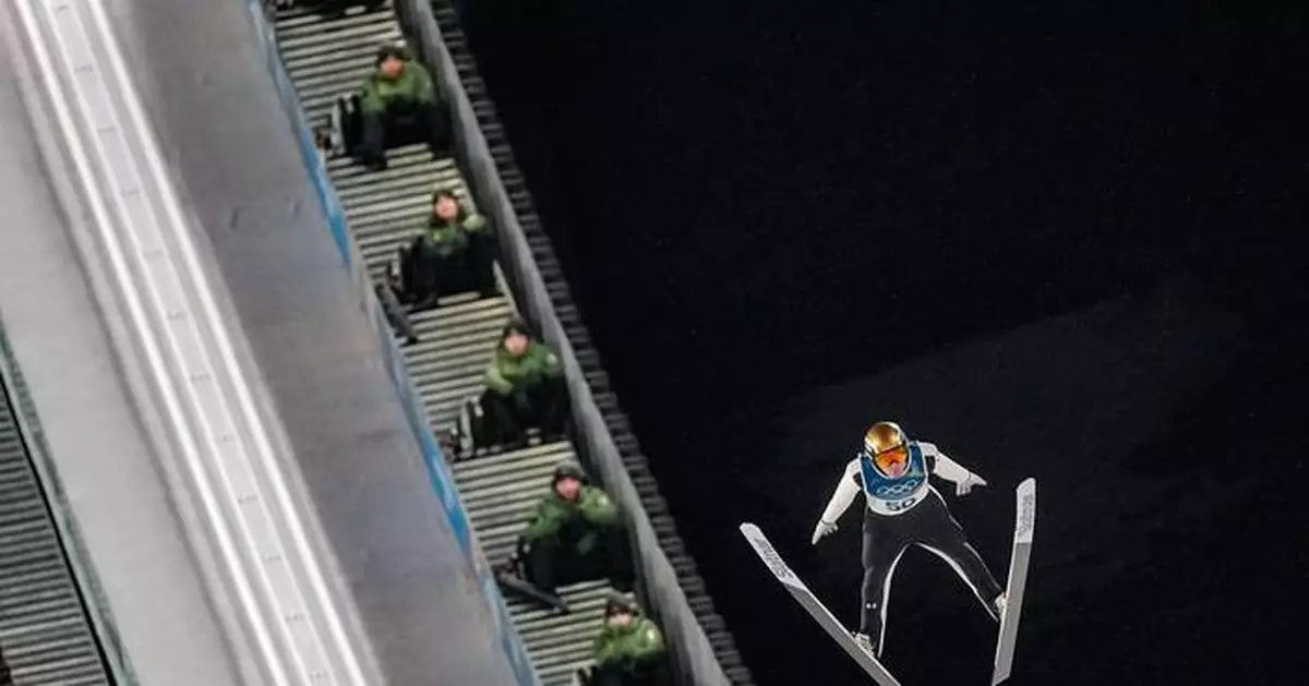 Slovenia's Domen Prevc lands big ski jump to capture gold on large hill at Milan Cortina Games