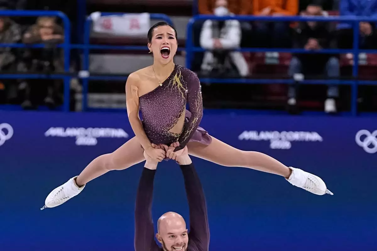 Ellie Kam and Danny O'Shea of the United States compete during the pairs figure skating short program at the 2026 Winter Olympics, in Milan, Italy, Sunday, Feb. 15, 2026. (AP Photo/Ashley Landis)