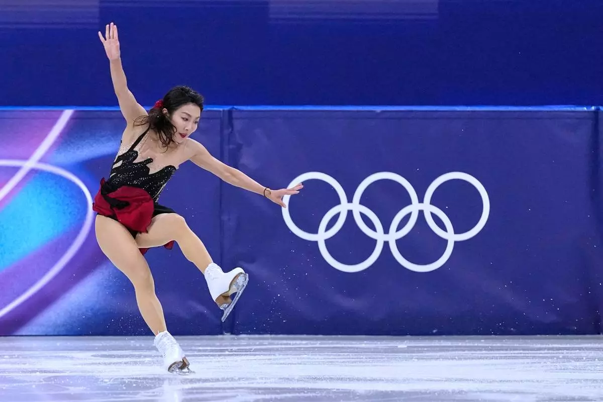 Sui Wenjing stumbles with her partner Han Cong of China compete during the pairs figure skating short program at the 2026 Winter Olympics, in Milan, Italy, Sunday, Feb. 15, 2026. (AP Photo/Natacha Pisarenko)