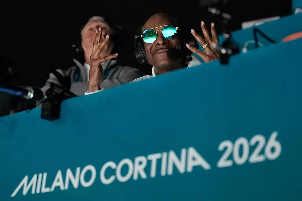 Snoop Dogg attends a men's ice hockey quarterfinal game between the United States and Sweden at the 2026 Winter Olympics, in Milan, Italy, Wednesday, Feb. 18, 2026. (AP Photo/Hassan Ammar)