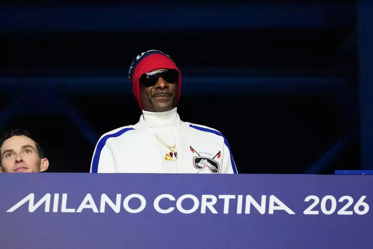 Snoop Dogg attends the women's short program figure skating at the 2026 Winter Olympics, in Milan, Italy, Tuesday, Feb. 17, 2026. (AP Photo/Natacha Pisarenko)