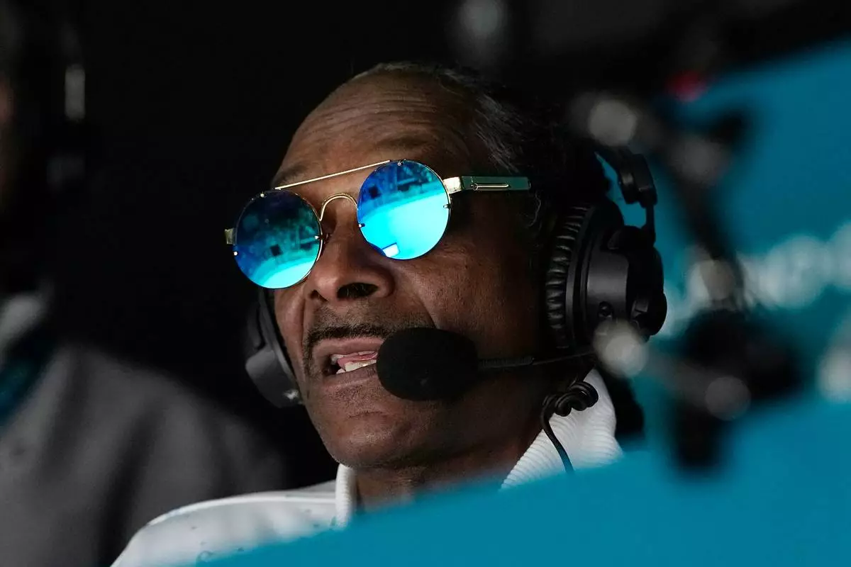 Snoop Dogg attends a men's ice hockey quarterfinal game between the United States and Sweden at the 2026 Winter Olympics, in Milan, Italy, Wednesday, Feb. 18, 2026. (AP Photo/Hassan Ammar)