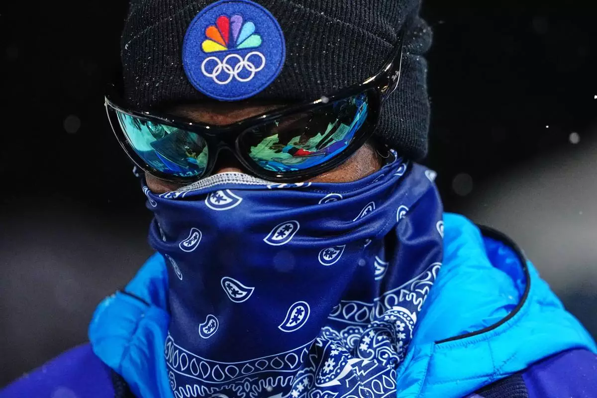 Snoop Dogg looks on during the women's snowboarding halfpipe finals at the 2026 Winter Olympics, in Livigno, Italy, Thursday, Feb. 12, 2026. (AP Photo/Lindsey Wasson)