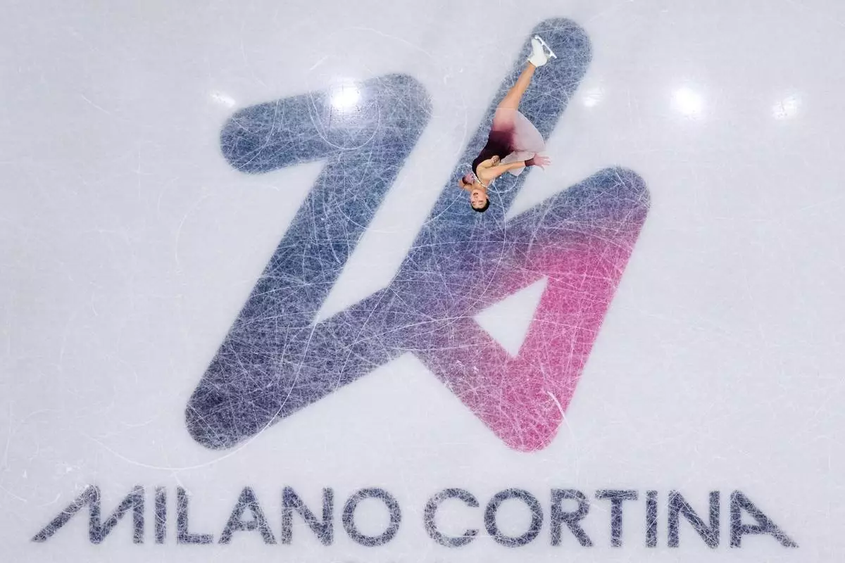 Kaori Sakamoto of Japan competes during the figure skating women's team event at the 2026 Winter Olympics, in Milan, Italy, Sunday, Feb. 8, 2026. (AP Photo/Bernat Armangue)