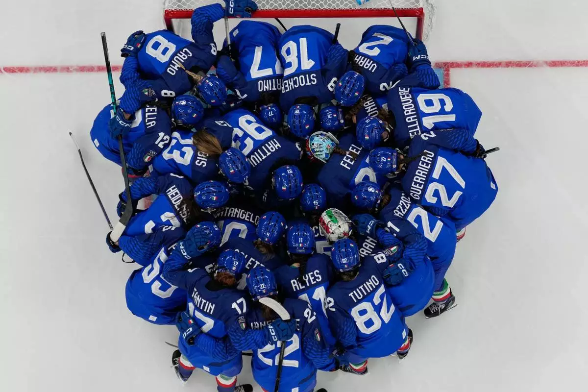 Italy players before during a preliminary round match of women's ice hockey between Italy and France at the 2026 Winter Olympics, in Milan, Italy, Thursday, Feb. 5, 2026. (AP Photo/Carolyn Kaster)