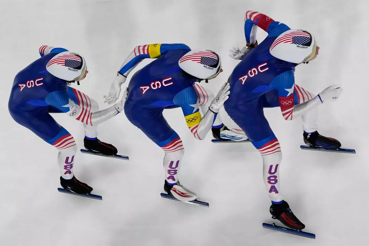 United States's Casey Dawson, right, Emery Lehman, center, and Ethan Cepuran compete during the speed skating men's team pursuit final at the 2026 Winter Olympics, in Milan, Italy, Tuesday, Feb. 17, 2026. (AP Photo/Christophe Ena)