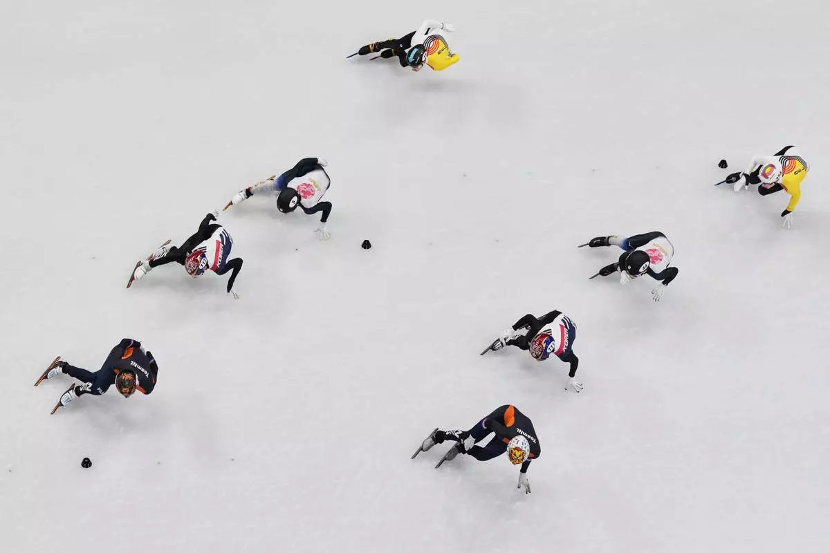 Team Netherlands leads the men's 5000m relay short track speed skating followed by South Korea, Japan and Belgium at the 2026 Winter Olympics, in Milan, Italy, Monday, Feb. 16, 2026. (AP Photo/Bernat Armangue)