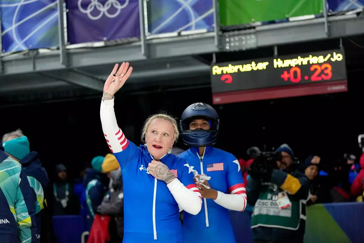 United States' Kaillie Armbruster Humphries, left, and Jasmine Jones, right, arrive at the finish during a two women bobsled run at the 2026 Winter Olympics, in Cortina d'Ampezzo, Italy, Friday, Feb. 20, 2026. (AP Photo/Alessandra Tarantino)