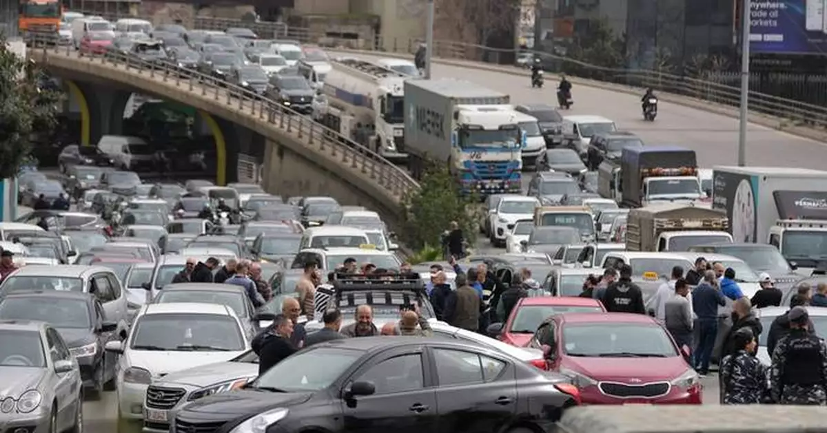 Protesters block Beirut roads after Cabinet approves new taxes that raise fuel prices