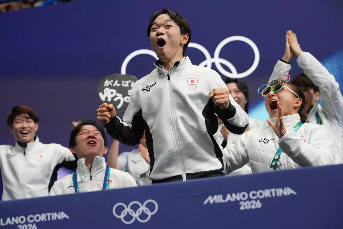 Yuma Kagiyama of Japan reacts to his scores after competing during the figure skating men's team event at the 2026 Winter Olympics, in Milan, Italy, Saturday, Feb. 7, 2026. (AP Photo/Francisco Seco)