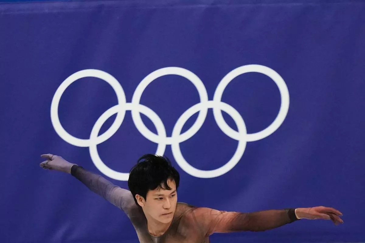 Adam Siao Him Fa of France competes during the men's figure skating short program at the 2026 Winter Olympics, in Milan, Italy, Tuesday, Feb. 10, 2026. (AP Photo/Stephanie Scarbrough)