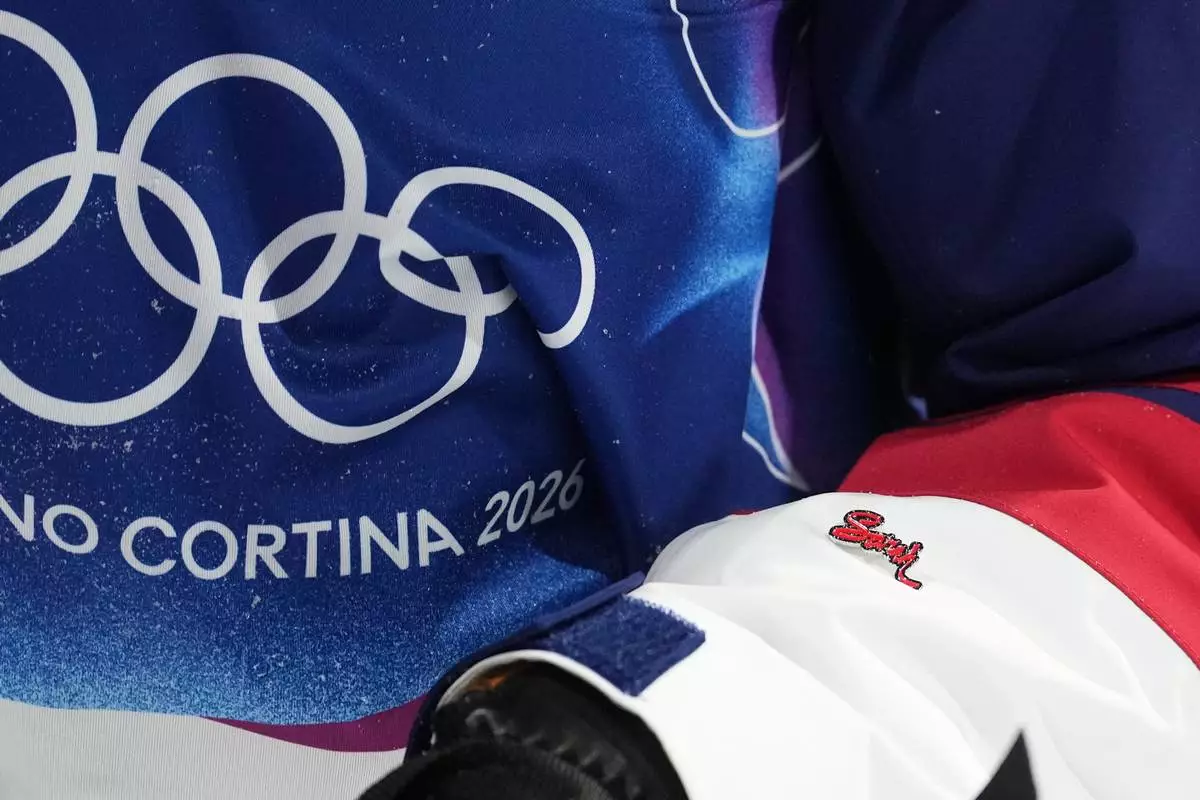 United States' Nick Goepper wears a "Sarah" pin during the men's freestyle skiing halfpipe finals at the 2026 Winter Olympics, in Livigno, Italy, Friday, Feb. 20, 2026. (AP Photo/Lindsey Wasson)