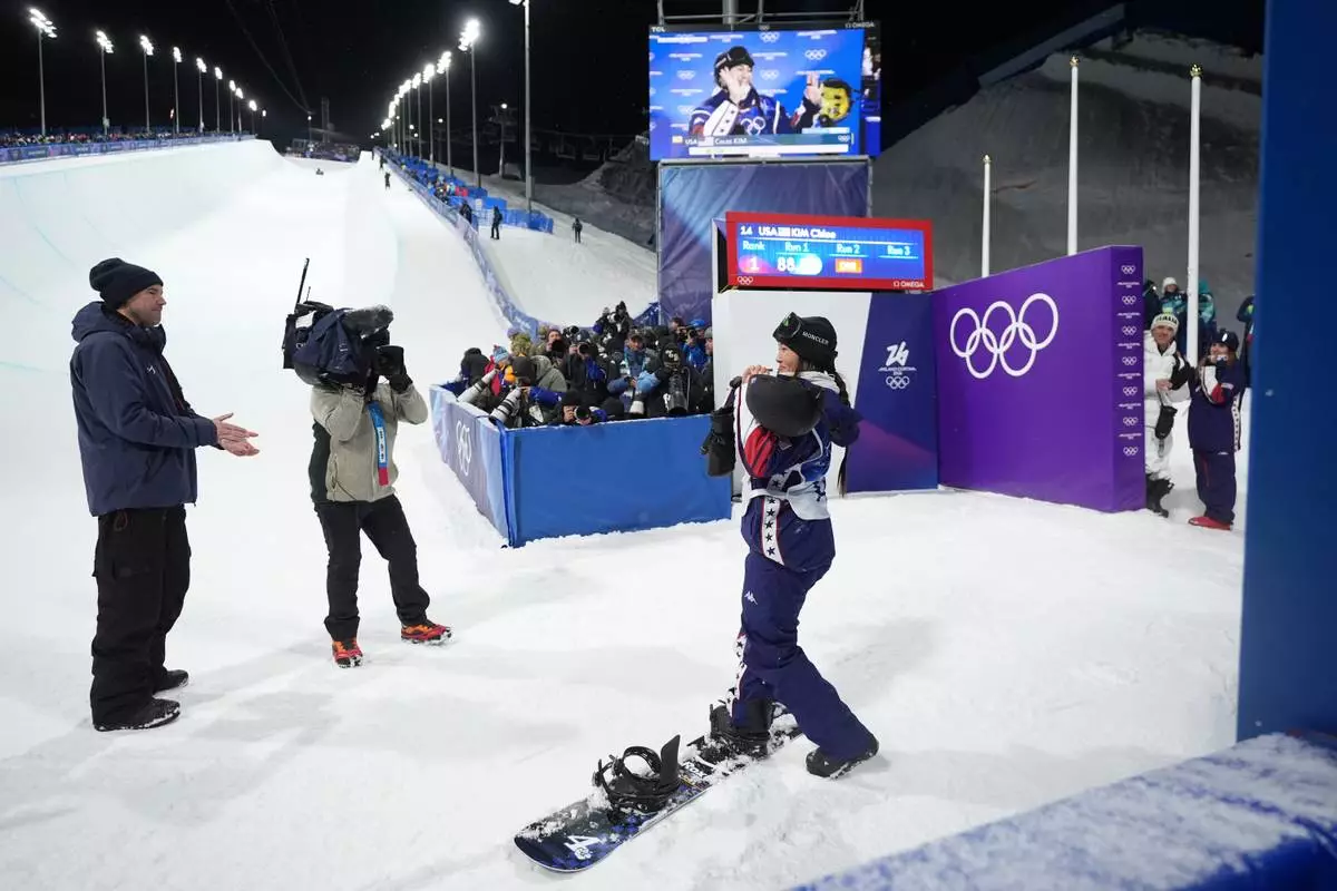 United States' Chloe Kim reacts after her second run during the women's snowboarding halfpipe finals at the 2026 Winter Olympics, in Livigno, Italy, Thursday, Feb. 12, 2026. (AP Photo/Lindsey Wasson)