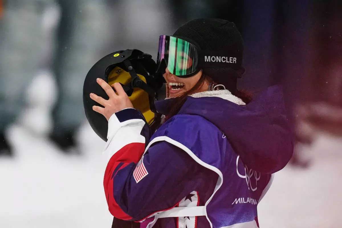United States' Chloe Kim waits for her score during the women's snowboarding halfpipe finals at the 2026 Winter Olympics, in Livigno, Italy, Thursday, Feb. 12, 2026. (AP Photo/Abbie Parr)
