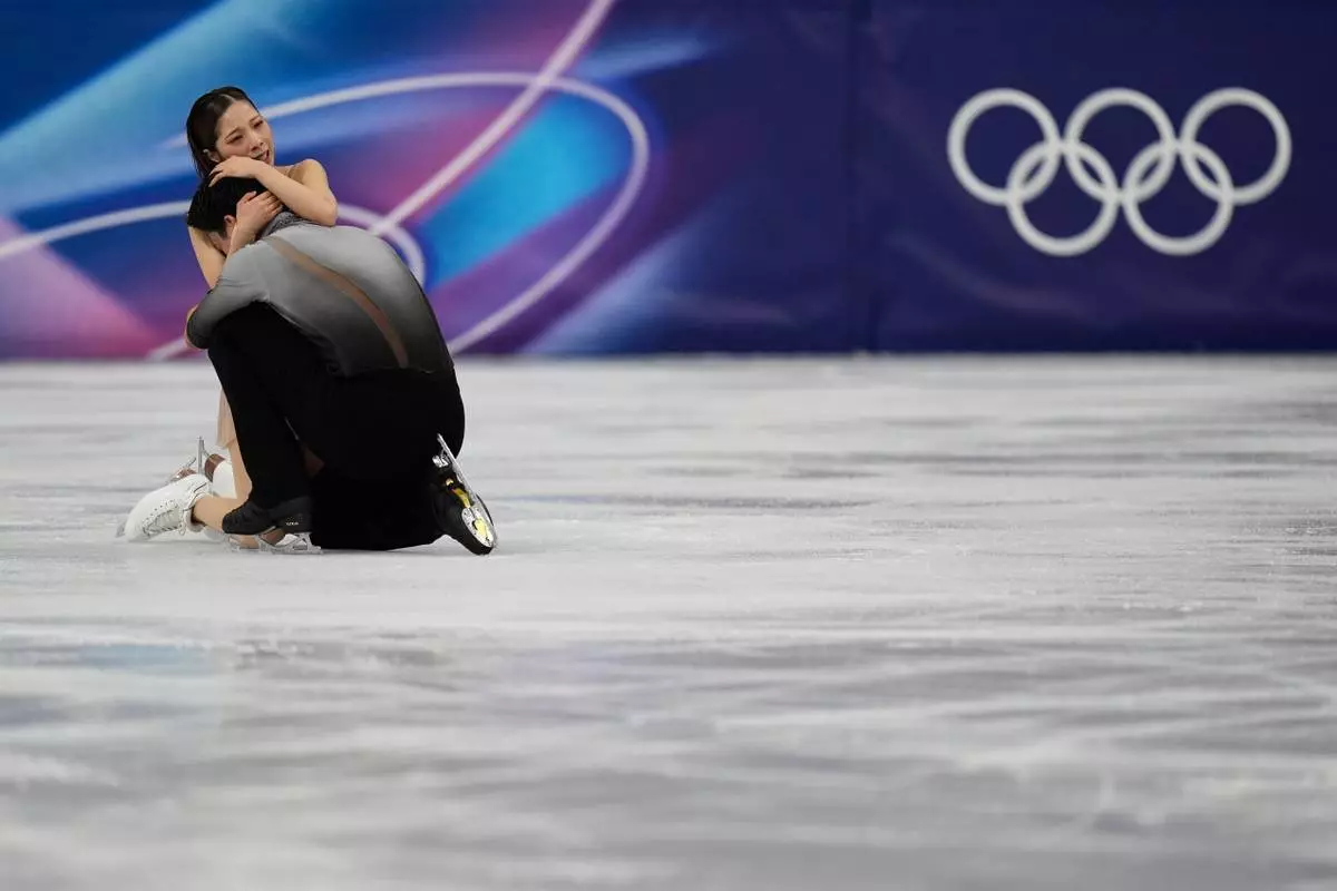 Riku Miura and Ryuichi Kihara of Japan compete during the pairs figure skating long program at the 2026 Winter Olympics, in Milan, Italy, Monday, Feb. 16, 2026. (AP Photo/Francisco Seco)