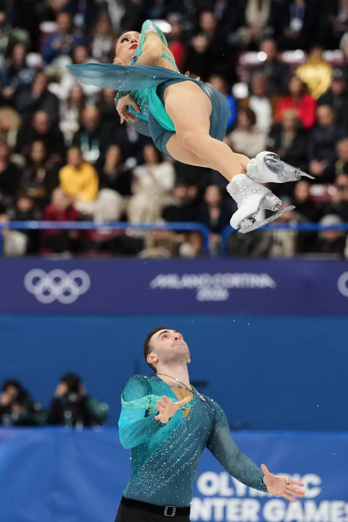 Anastasiia Metelkina and Luka Berulava of Georgia compete during the pairs figure skating long program at the 2026 Winter Olympics, in Milan, Italy, Monday, Feb. 16, 2026. (AP Photo/Francisco Seco)