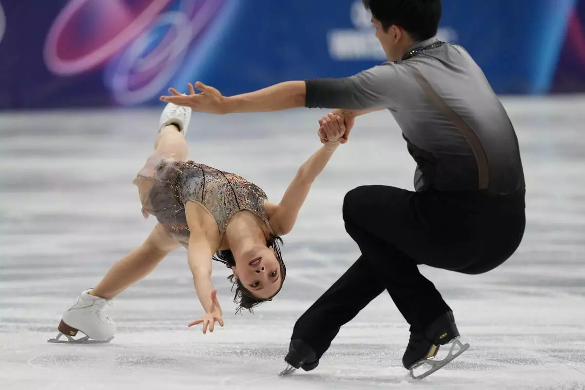 Riku Miura and Ryuichi Kihara of Japan compete during the pairs figure skating long program at the 2026 Winter Olympics, in Milan, Italy, Monday, Feb. 16, 2026. (AP Photo/Stephanie Scarbrough)