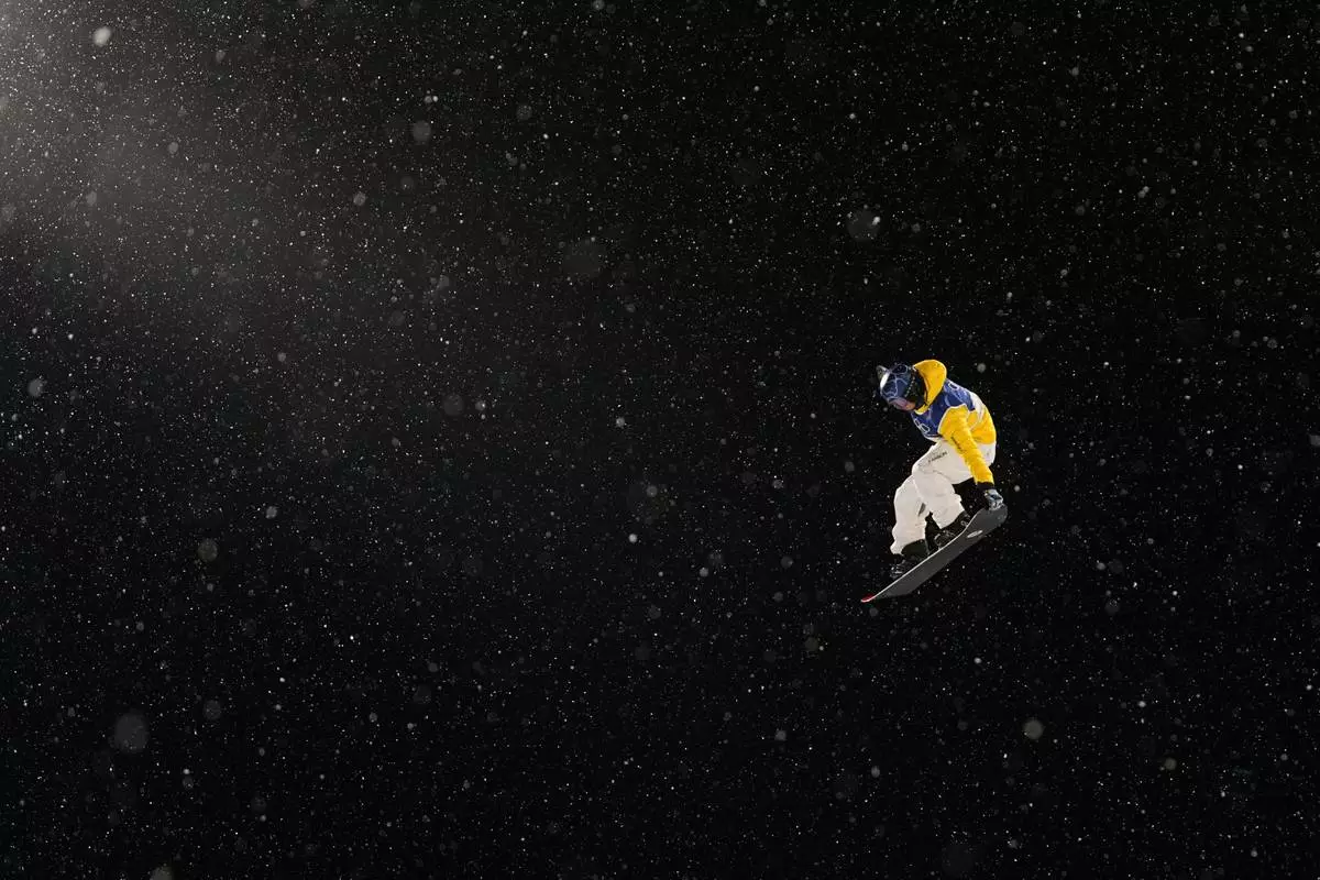 Australia's Valentino Guseli practices before the men's snowboarding halfpipe qualifications at the 2026 Winter Olympics, in Livigno, Italy, Wednesday, Feb. 11, 2026. (AP Photo/Gregory Bull)