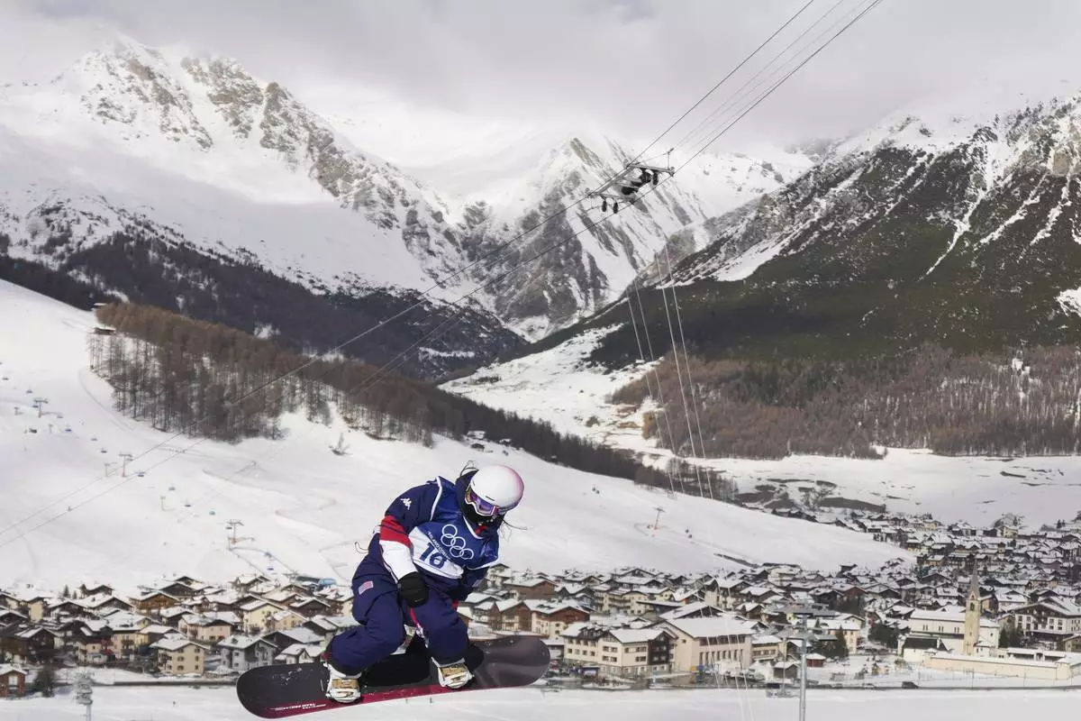 United States' Bea Kim competes during the women's snowboarding halfpipe qualifications at the 2026 Winter Olympics, in Livigno, Italy, Wednesday, Feb. 11, 2026. (AP Photo/Abbie Parr)