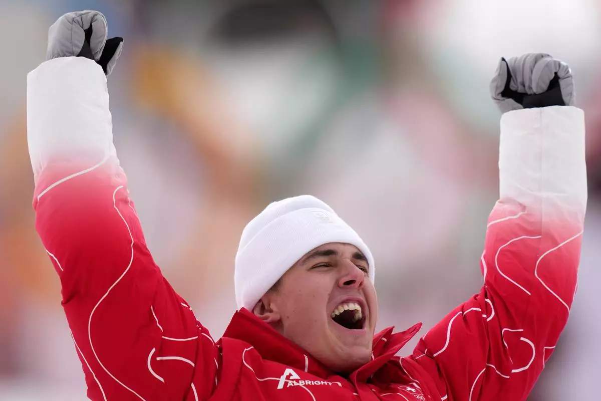 Switzerland's Franjo von Allmen celebrates winning the gold medal in a men's super-G race, at the 2026 Winter Olympics, in Bormio, Italy, Wednesday, Feb.11, 2026. (AP Photo/Julia Demaree Nikhinson)