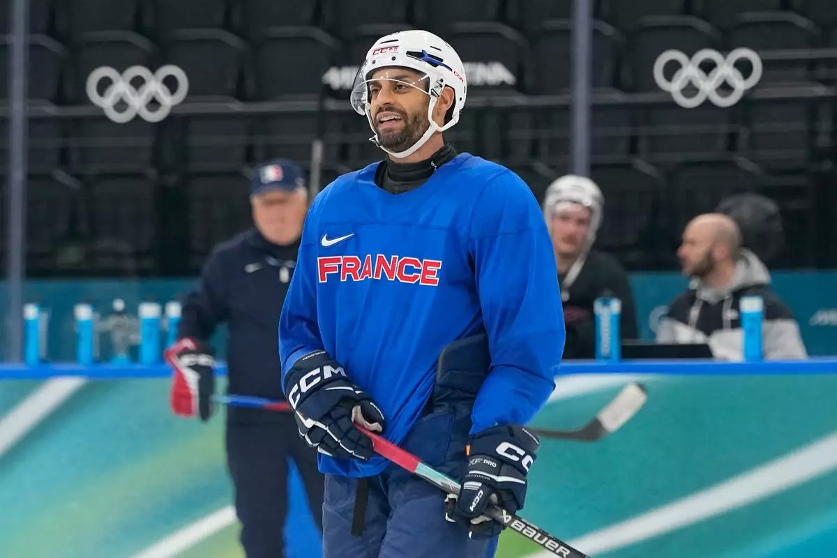 France's Pierre-Edouard Bellemare skate on the ice during a training session prior to the 2026 Winter Olympics, in Milan, Italy, Wednesday, Feb. 4, 2026. (AP Photo/Hassan Ammar)