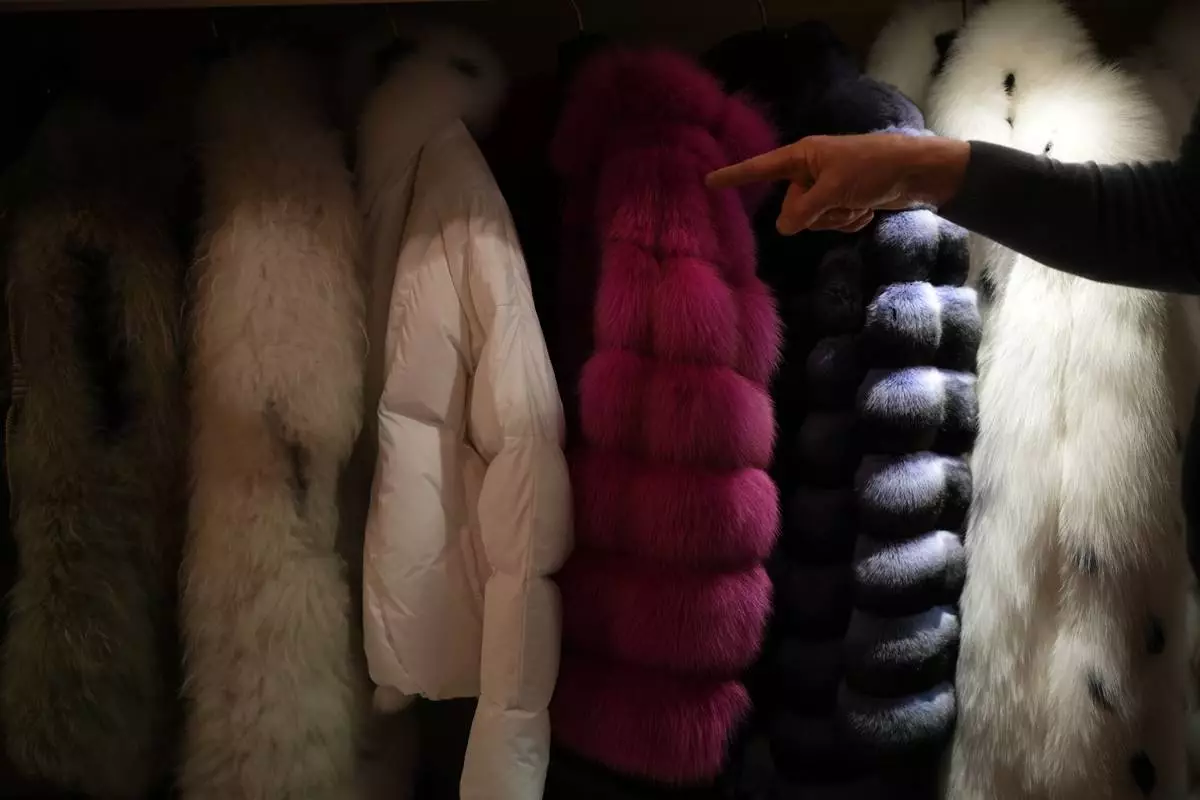 Fur coats are displayed at the Pajaro shop, a luxury Italian fashion brand, in Cortina d'Ampezzo, Italy, Sunday, Feb. 15, 2026. (AP Photo/Alessandra Tarantino)