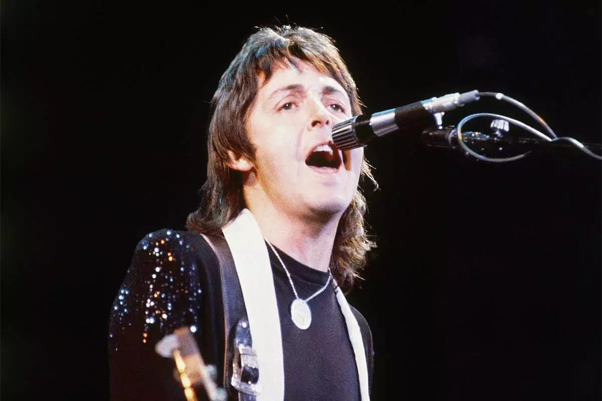 FILE - Paul McCartney, of Paul McCartney and Wings, performs at the Nassau Coliseum in Uniondale, N.Y. on May 21, 1976. (AP Photo/Richard Drew, File)