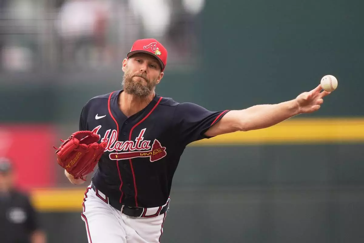 CORRECTS CITY TO NORTH PORT FLORIDA NOT BRADENTON - Atlanta Braves pitcher Chris Sale delivers in the first inning of a spring training baseball game against the Minnesota Twins in North Port, Fla., Sunday, Feb. 22, 2026. (AP Photo/Gerald Herbert)