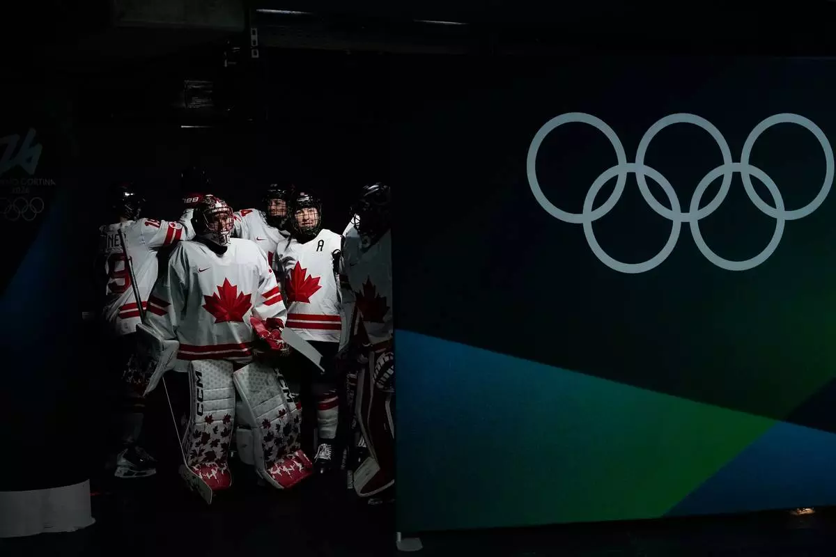 Canada's players arrive for the warm up ahead of a women's ice hockey gold medal game between the United States and Canada at the 2026 Winter Olympics, in Milan, Italy, Thursday, Feb. 19, 2026. (AP Photo/Petr David Josek)