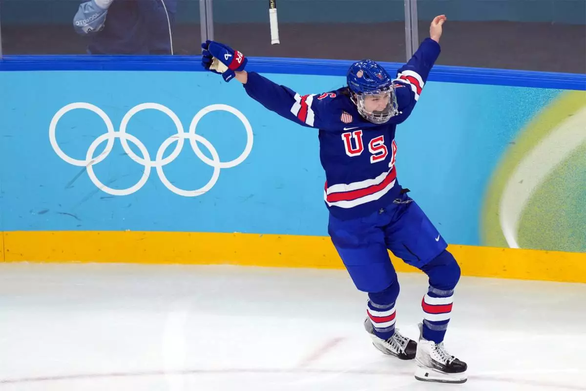United States' Megan Keller celebrates after scoring the winning goal against Canada during the overtime period of the women's ice hockey gold medal game at the 2026 Winter Olympics, in Milan, Italy, Thursday, Feb. 19, 2026. (AP Photo/Carolyn Kaster)
