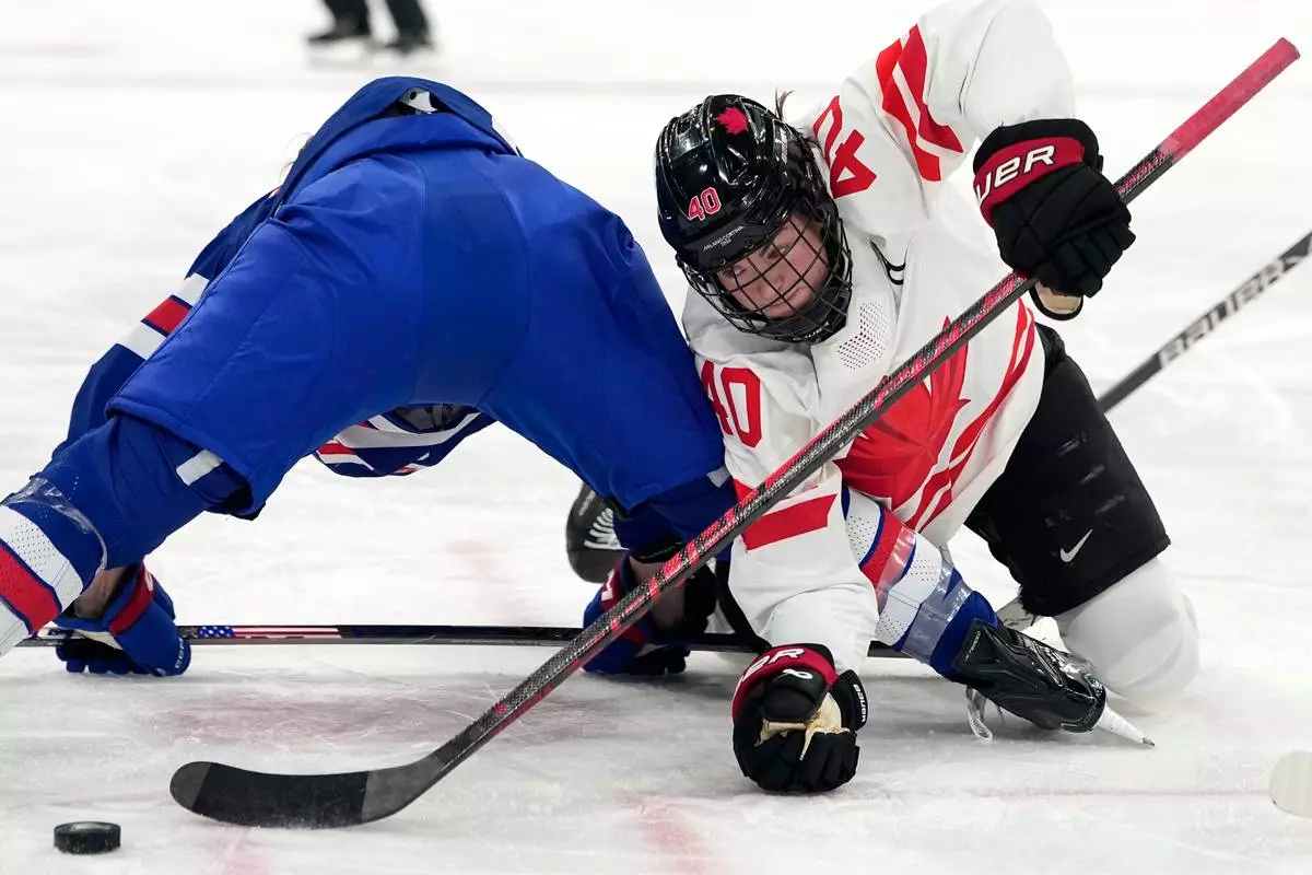 Canada's Blayre Turnbull (40) is in action during a women's ice hockey gold medal game between the United States and Canada at the 2026 Winter Olympics, in Milan, Italy, Thursday, Feb. 19, 2026. (AP Photo/Hassan Ammar)