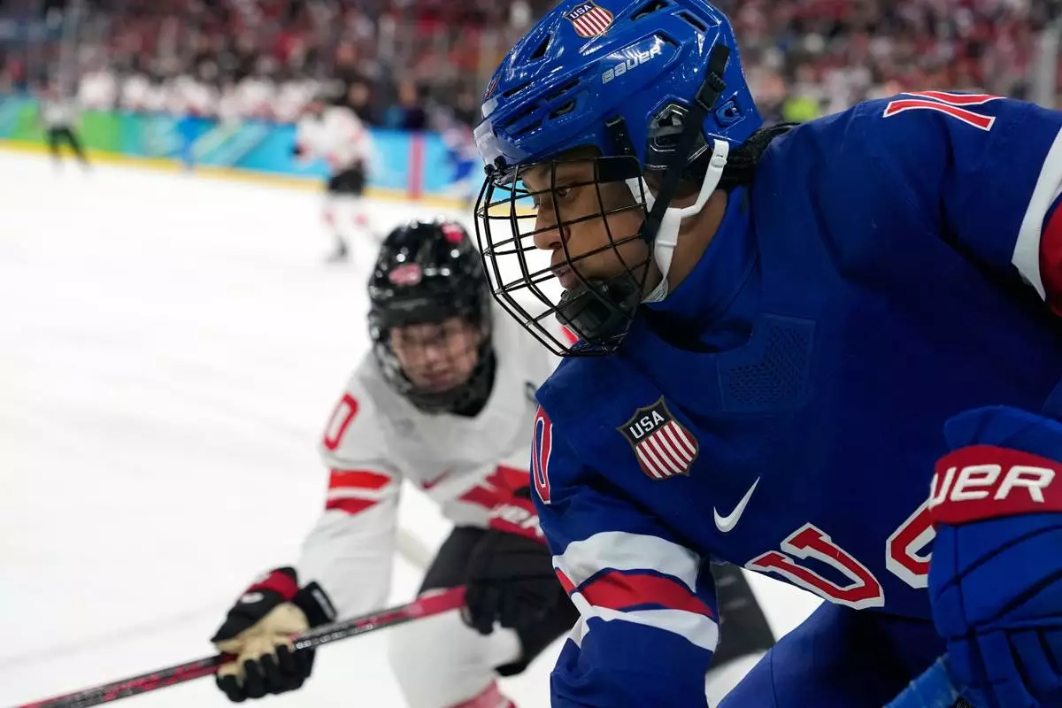 United States' Laila Edwards (10) is in action during a women's ice hockey gold medal game between the United States and Canada at the 2026 Winter Olympics, in Milan, Italy, Thursday, Feb. 19, 2026. (AP Photo/Hassan Ammar)