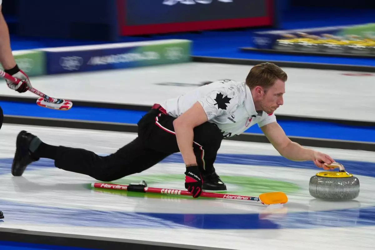 Canada's Marc Kennedy competes during a men's curling gold medal match between Britain and Canada, at the 2026 Winter Olympics, in Cortina d'Ampezzo, Italy, Saturday, Feb. 21, 2026. (AP Photo/Misper Apawu)