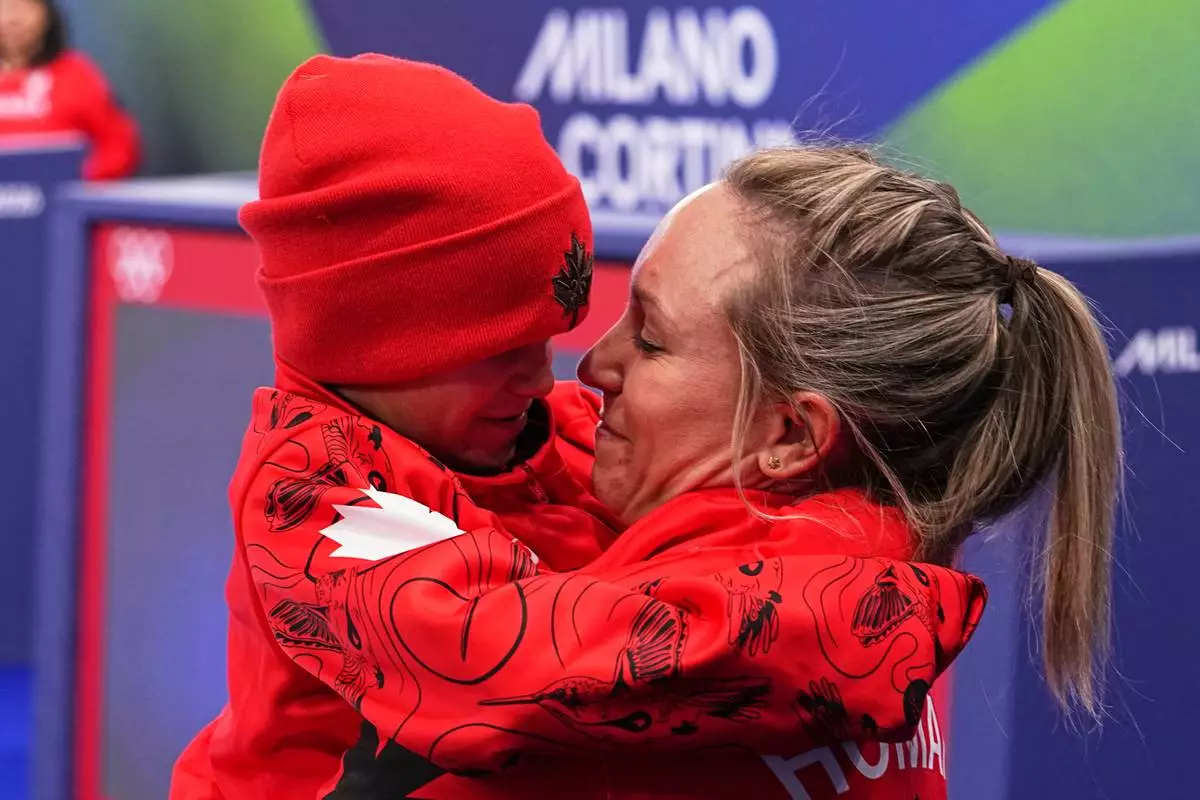 Canada's Rachel Homan celebrates winning the women's curling bronze medal match against the United States, at the 2026 Winter Olympics, in Cortina d'Ampezzo, Italy, Saturday, Feb. 21, 2026. (AP Photo/Fatima Shbair)