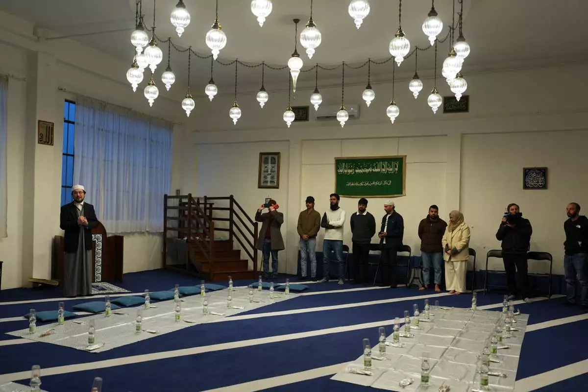 Imam Yahya Pallavicini, vice president of the Italian Islamic Religious Community, speaks at the Al-Wahid mosque during Ramadan in Milan, Italy, Friday, Feb. 20, 2026, as the city hosts the Winter Olympics. (AP Photo/María Teresa Hernández)