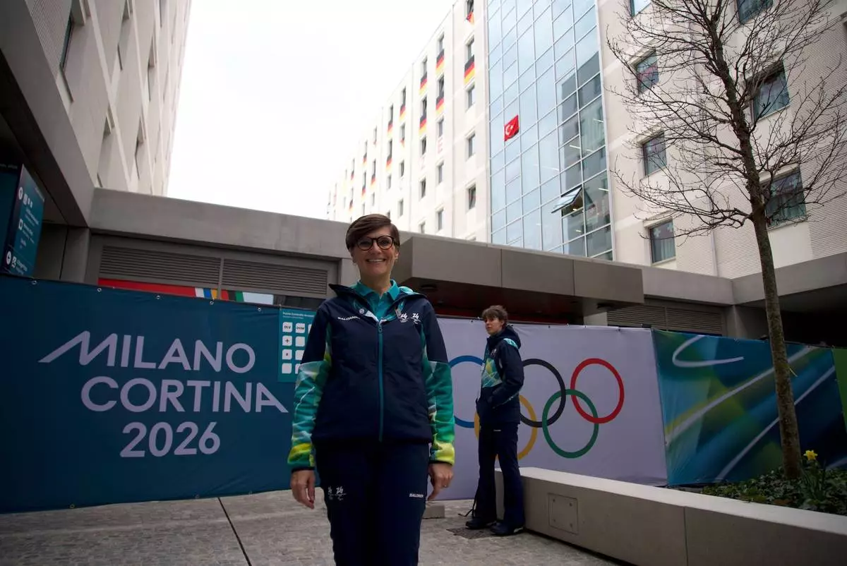 Olivia Azzalin, a volunteer poses for a photo at the Olympic Village, at the 2026 Winter Olympics, in Milan, Italy, Monday, Feb. 9, 2026. (AP Photo/Vasilisa Stepanenko)